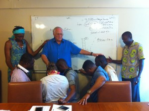 Loren praying over African Pastors